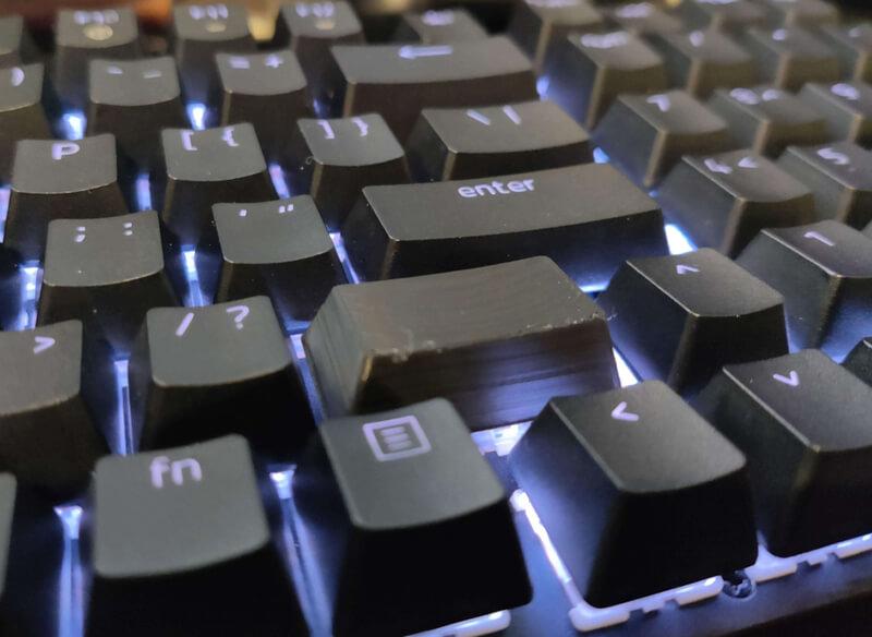 Close up of a keyboard with a 3d printed shift key